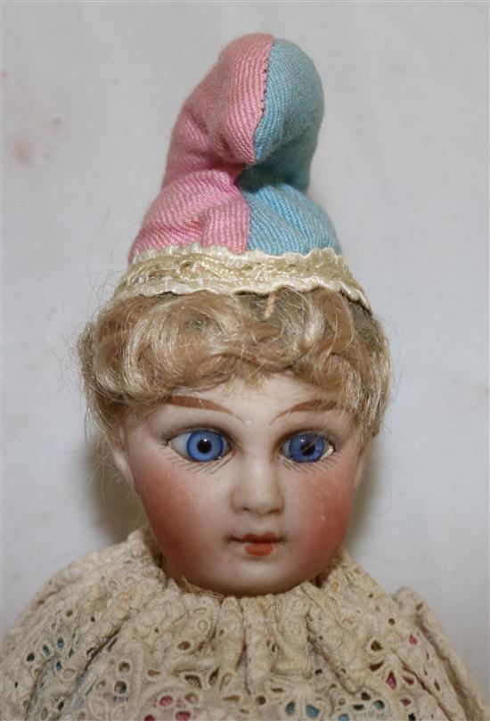 A French bisque head marotte, made by Schoenau & Hoffmeister, 13.5in.